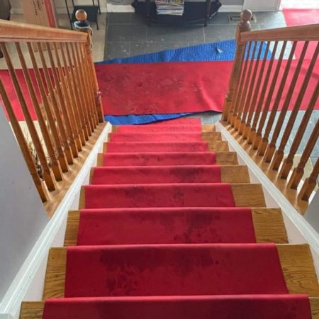 Fabric runners are laid down to protect both the floor surface and provide traction for movers working in wet conditions